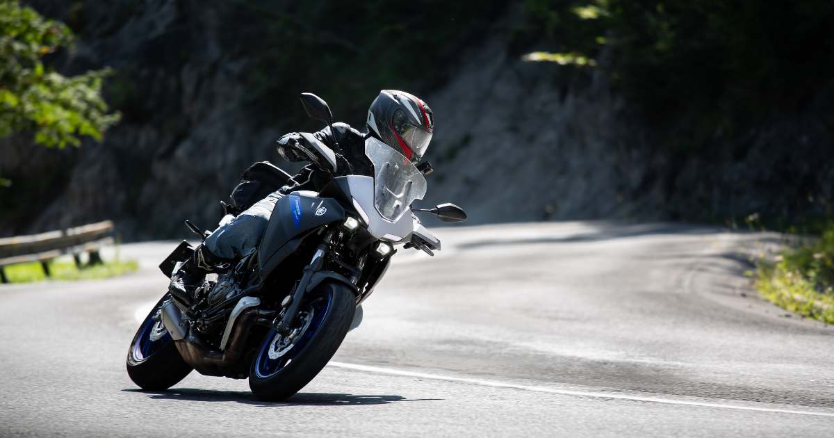 A man riding a street bike motorcycle