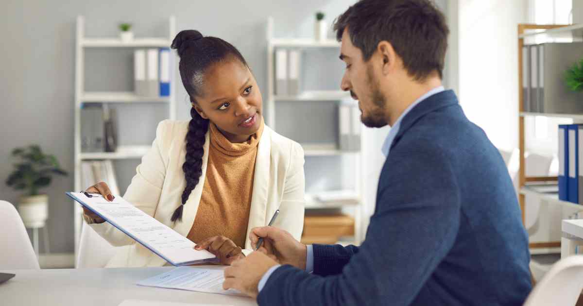 A Highway Title Loans customer signing off on a registration loan.