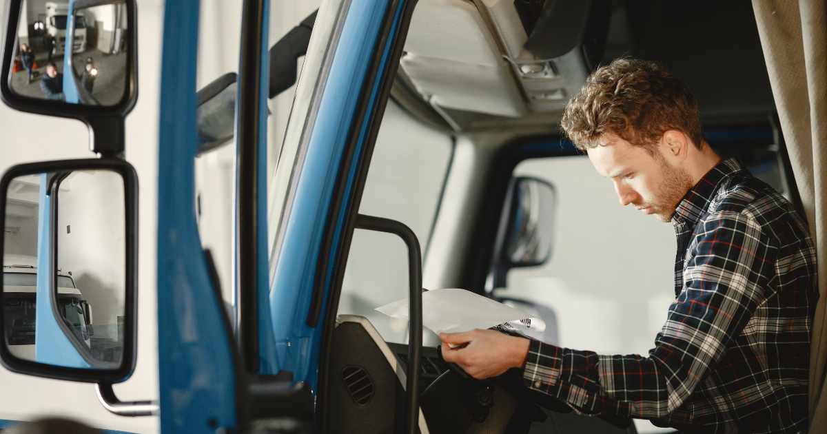 A truck driver reviewing a title loan contract.